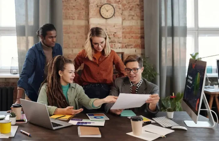 Marketing team reviewing a customer funnel diagram together